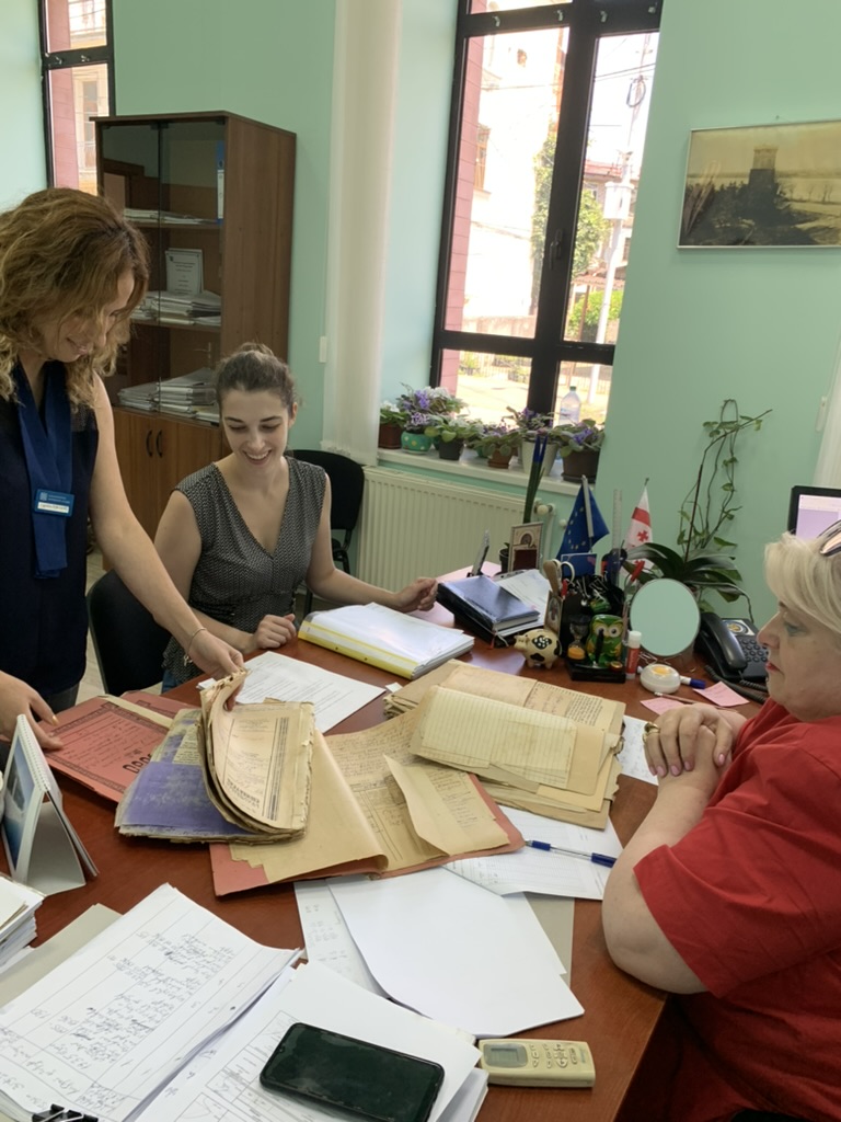 graduate student viewing archival materials