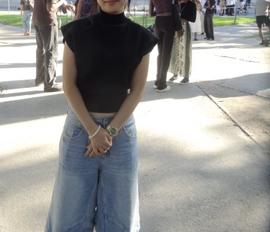 Student posing in front of Widener Library